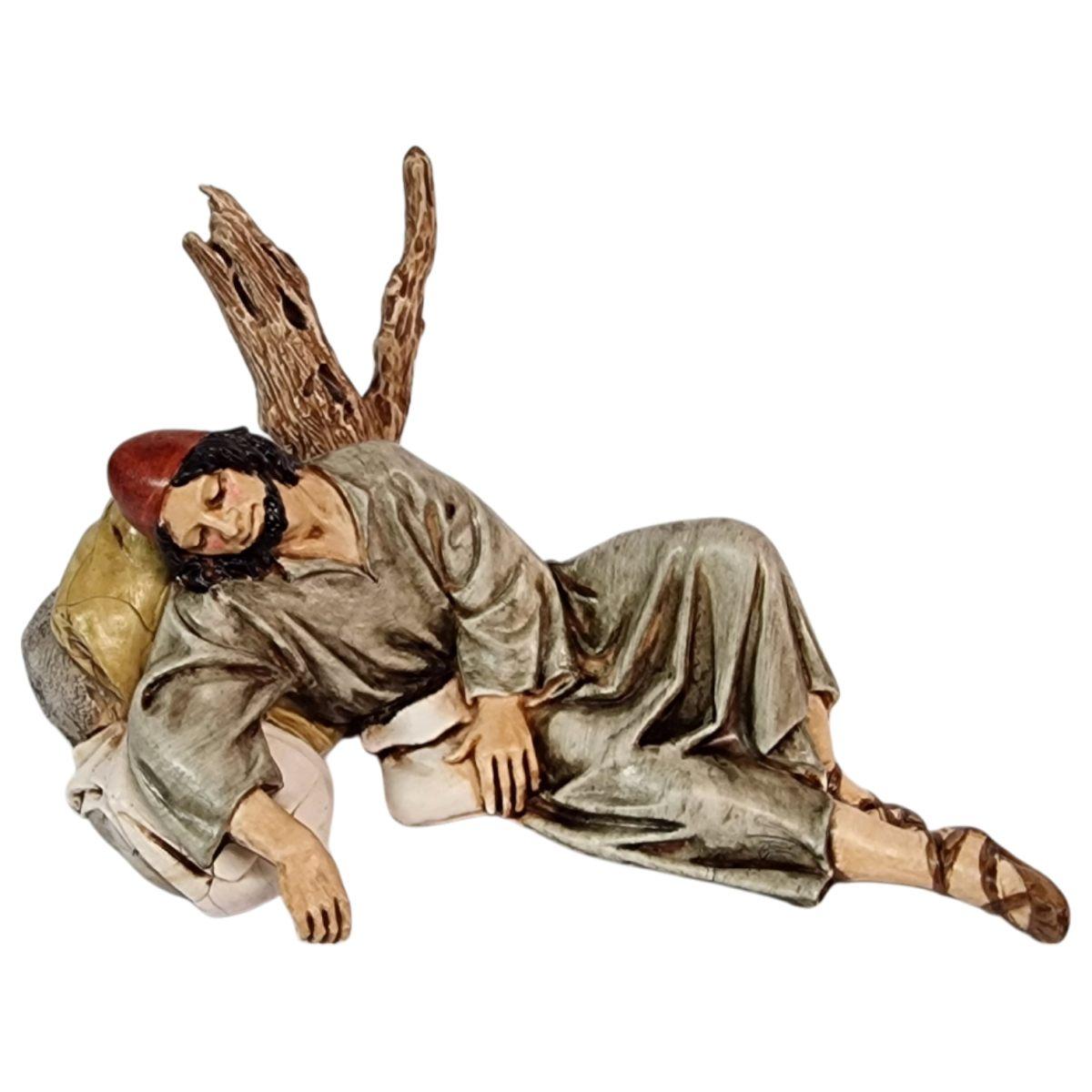 Statua presepe 13 cm dormiente sdraiato sul tronco