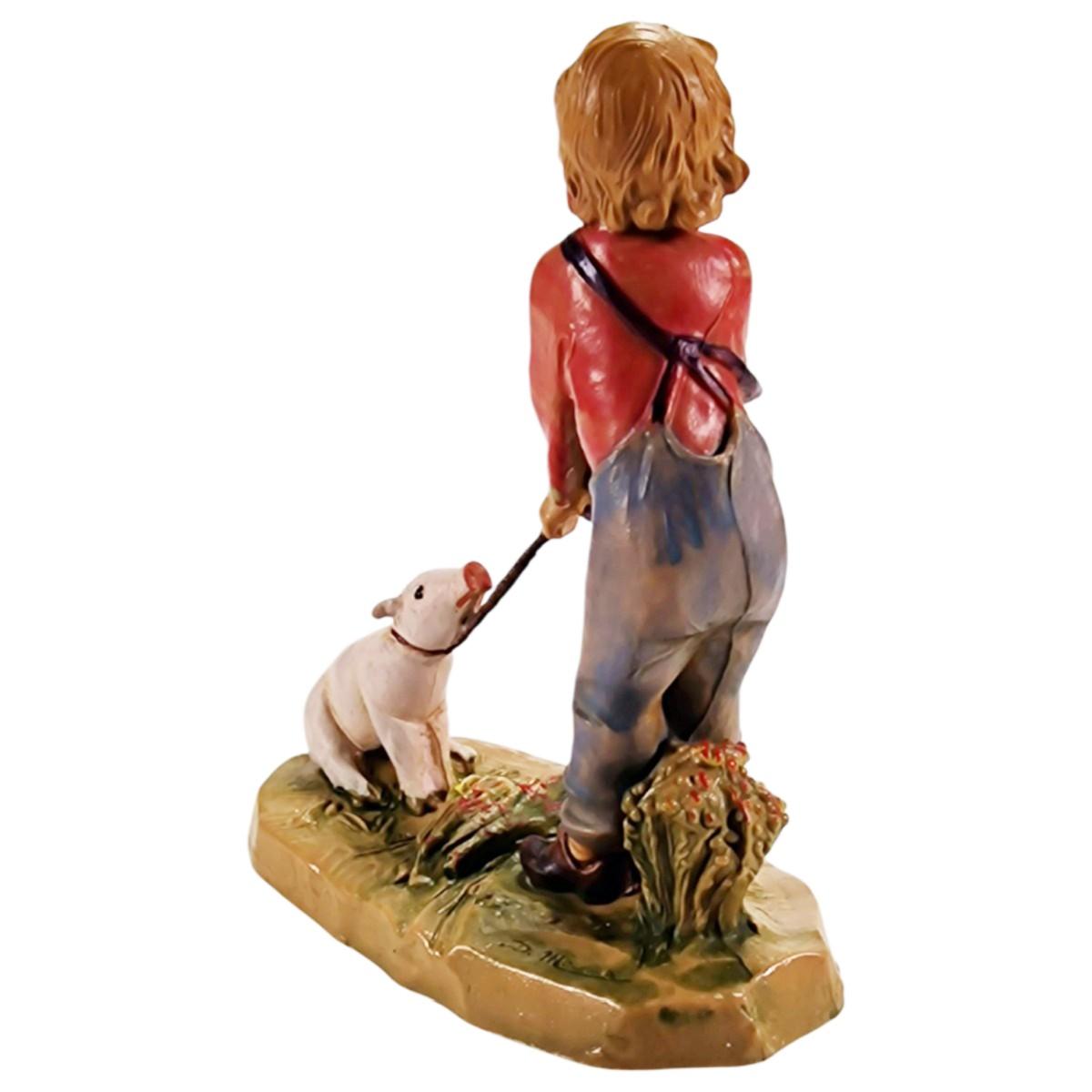 Statua presepe 12 cm bambino che tira il maiale